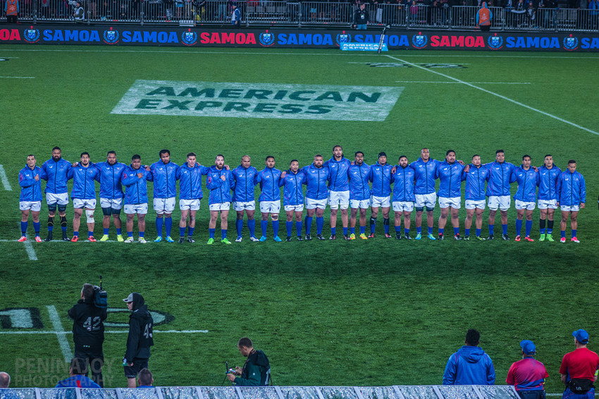 Team standing to attention during the anthem