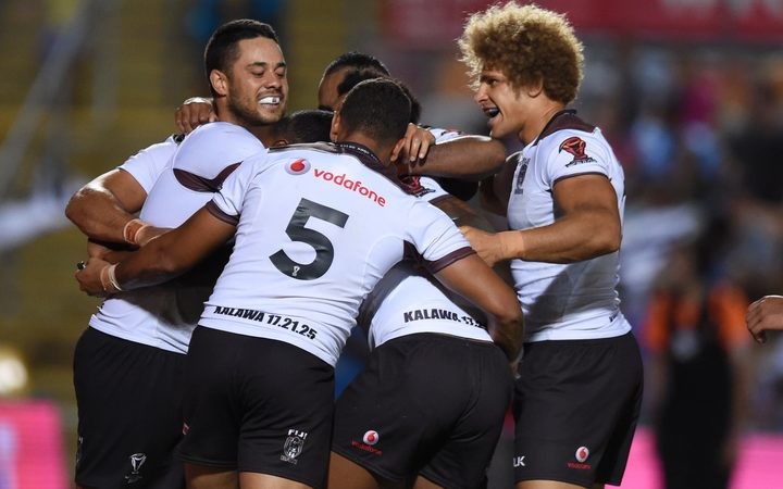Jarryd Hayne celebrates a win with his Fiji Bati team mates