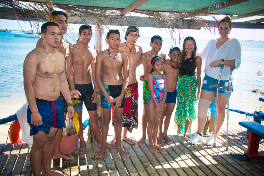 Members of the Malolo Swim club on Pangaimotu Island Resort with netball star Cathrine Tuivaiti