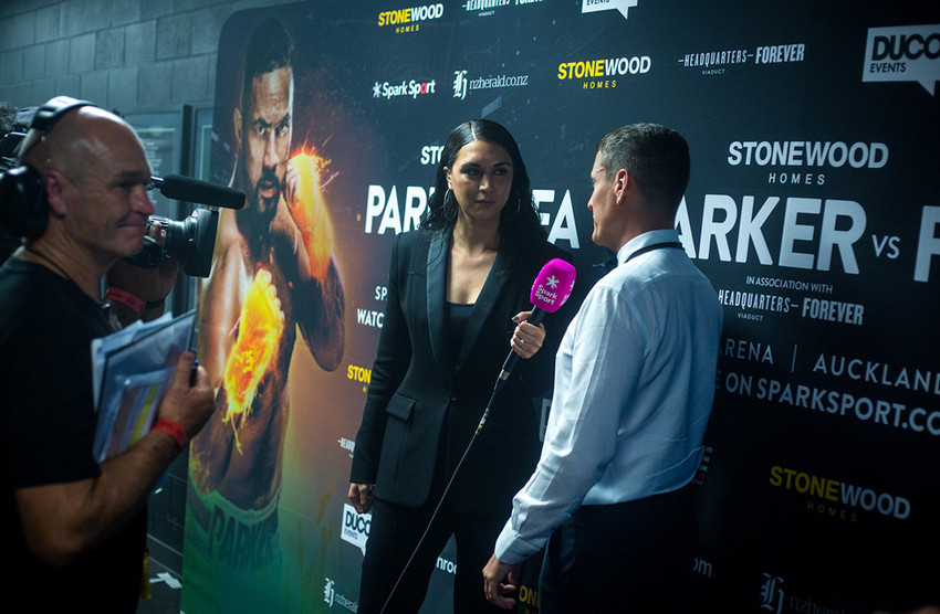 Leilani interviewing Duco Events boss David Higgins behind the scenes of the Parker vs Fa fight night