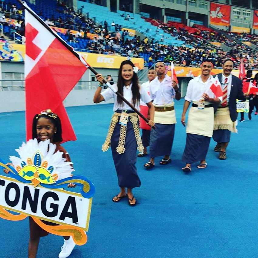 Noelani walking in with the flag for the Commonwealth Youth Games
