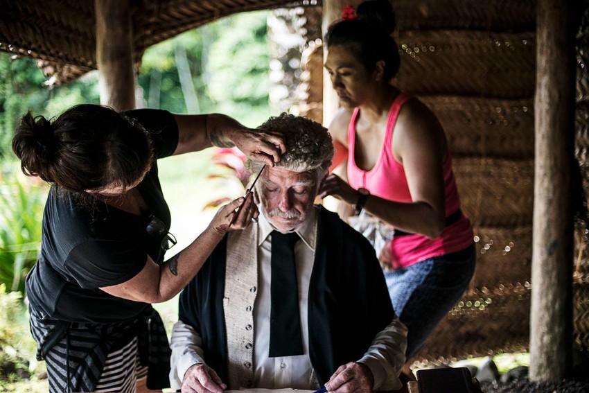 Make up artist, Levonne Scott, and Wardrobe Artist Katerina Fatupaito (pink) apply final touches to Co-lead Peter Hayden. Photo credit: Raymond Sagapolutele