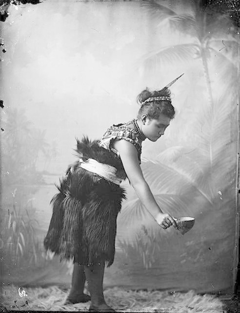 Samoan princess wearing a Ie Sina or shaggy like garment used by woman of high status on important events