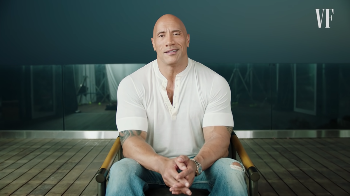 prompthunt: Dwayne Johnson is looking intensely at the camera with