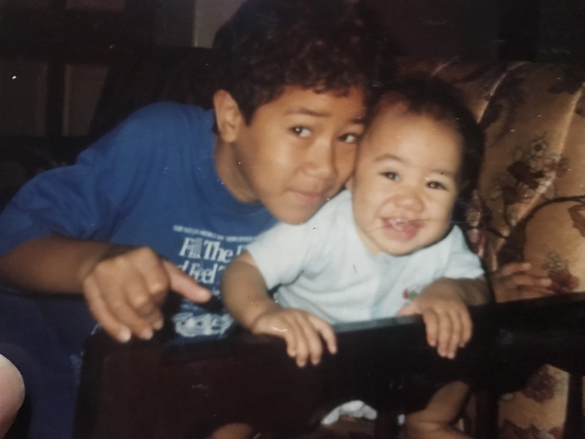 Tai with his siblings and family back in the day