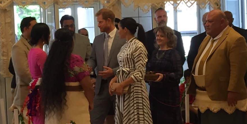 Elizabeth with two youth representatives telling Prince Harry and Megan Markle about Tonga's Girls Takeover Parliament
