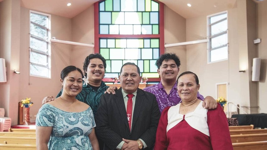 Pouesi with his family. He is flanked by daughter Siuila and wife Salome, while his sons Paluksantos and Taeaofouimageleisasa'e are behind him. Photo Credit Stuff