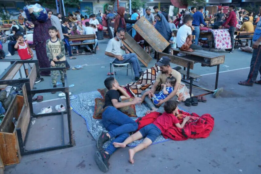 Palestinians take shelter in a U.N. run school in Nuiserat refugee camp on Saturday, Oct. 14, 2023