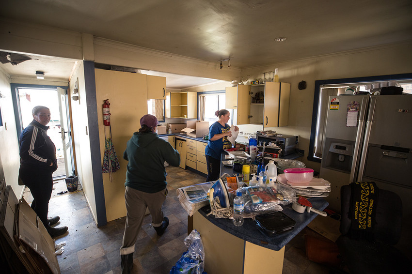 Carlas friends & sister-in-law assist with the clean-up inside the house