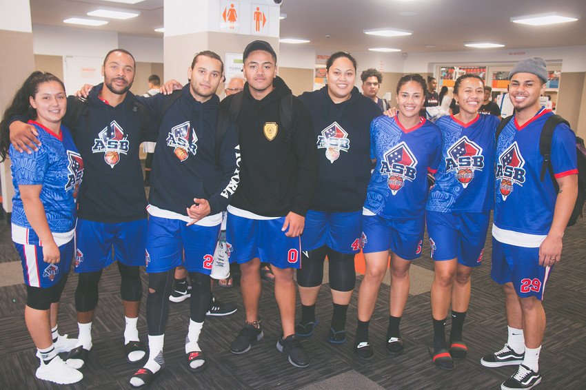 Team captain of the Victoria Open Mens side Justin Talauega (Far right) with their coach (4th from right) & some of the Victoria Basketball squad