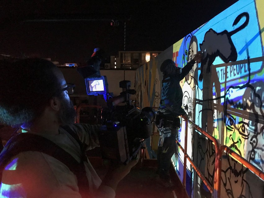 Working after hours to get the mural done (PC: Liberation Library NZ)