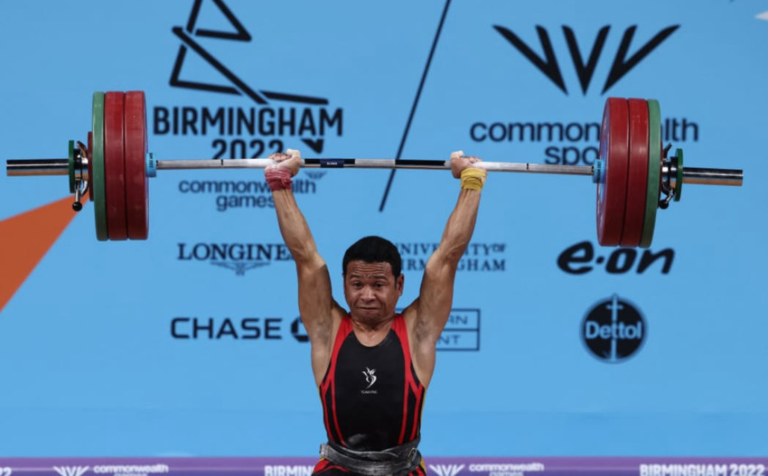 Papua New Guinea's Morea Baru competes in the men's 61kg weightlifting event on day two of the Commonwealth Games at the NEC Arena in Birmingham. Photo: DARREN STAPLES via RNZ Pacific