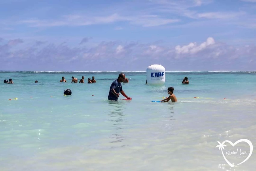 Kieran with children in the water Photo Credit: Island Love Photography