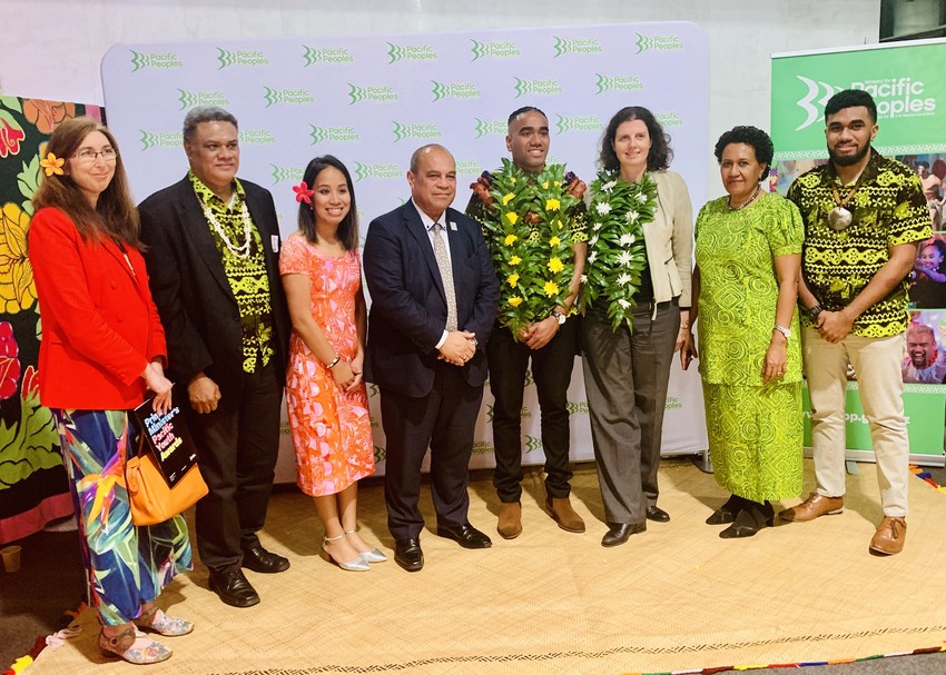 Tupou Veiogo with his family and Deloitte staff