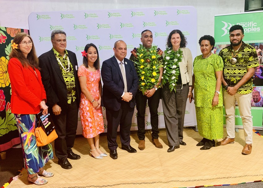 Tupou Veiogo with his family and Deloitte staff
