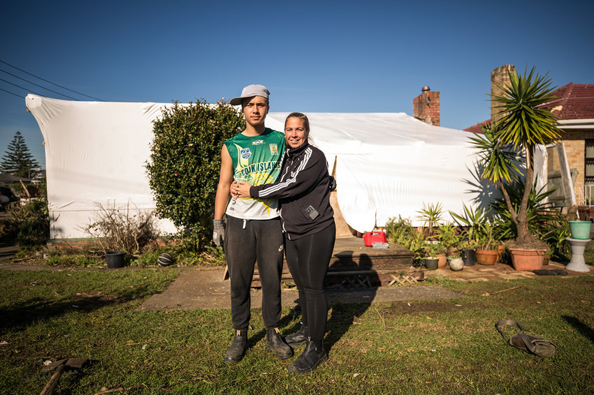 Carla and her son Jordyn outside their house standing in the spot where Jordyn filmed the tornado from inside his car.