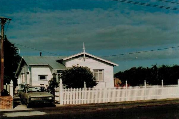 My house growing up in Manurewa. This photo is back when my father had just finished making and painting the f nce and gate. The car was our family valiant that took us on many road trips together.