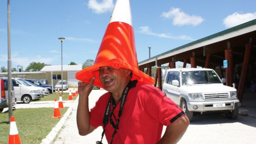 Dad used to take pictures of arrivals and departures at the airport. He likes to clown around too, a very hot day so using a traffic cone for a hat. Where are the Police?