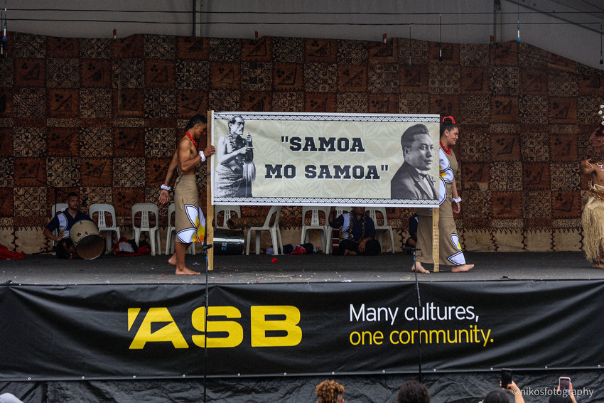 Emanuel Tereva and Nivea Ironside from Marcellin College exit the stage proudly sharing the banner. Photo Credit: Frank Talo / NikosFotography