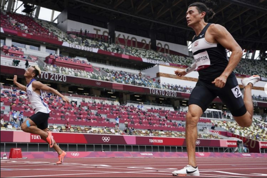 han Crumpton (right) competing in the Mens 100m at the Tokyo Olympics