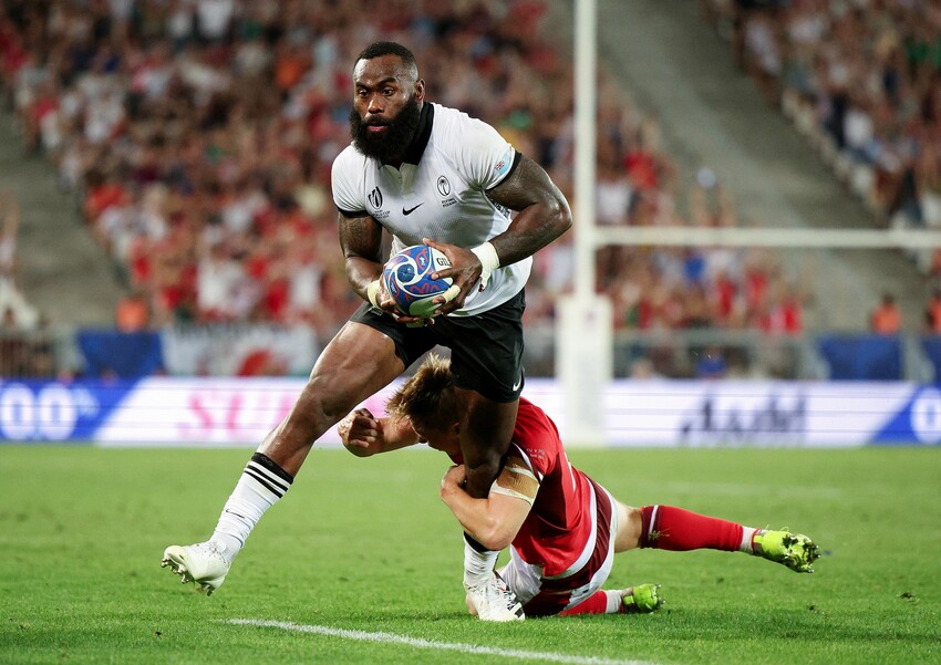 Semi Radradra of Fiji is tackled by Sam Costelow of Wales during the Rugby World Cup France 2023 match between Wales and Fiji at Nouveau Stade de Bordeaux on September 10, 2023 in Bordeaux, France. (Photo by Adam Pretty - World Rugby/World Rugby via