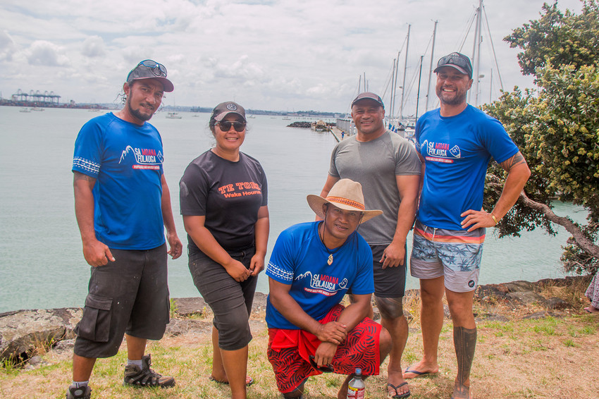 Gaualofa skipper Fealofani Bruin with her crew and overseeing repairs on the va'a