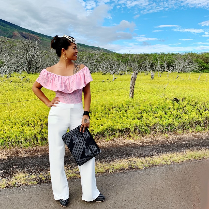 A new one-off piece: Shoulder ruffle top in the Kukulunuiahina design (representing the great rain pillars of Hina on Molokai Island). Accessories - a canvas clutch and high heels. Location: Kamalo, Molokai.