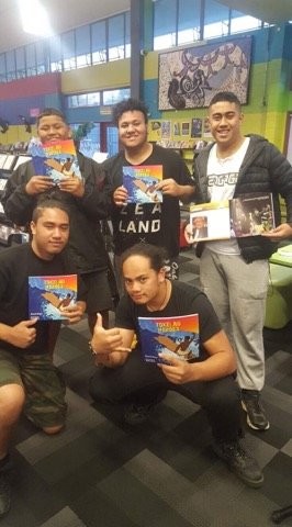 Pacific students with his books