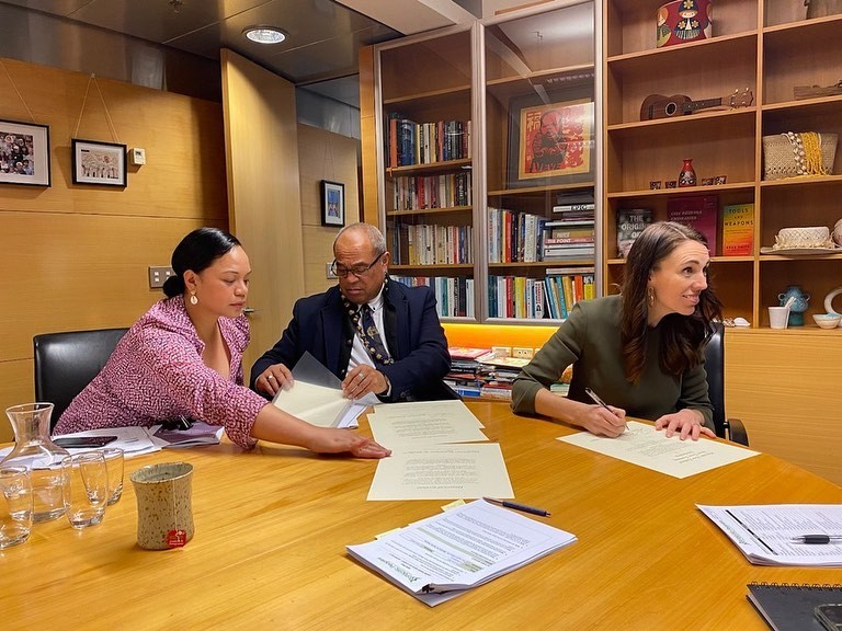 Koula at work with the Minister for Pacific Peoples Aupito William Sio and Prime Minister Jacinda Ardern