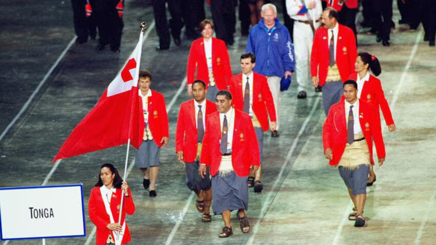Flag Bearer Ana Siulolo Liku leads round the Tongan Olympic Team during the Opening Ceremony of the Sydney 2000 Olympic Games. Credit: Clive Brunskill /Allsport Source: Getty Images