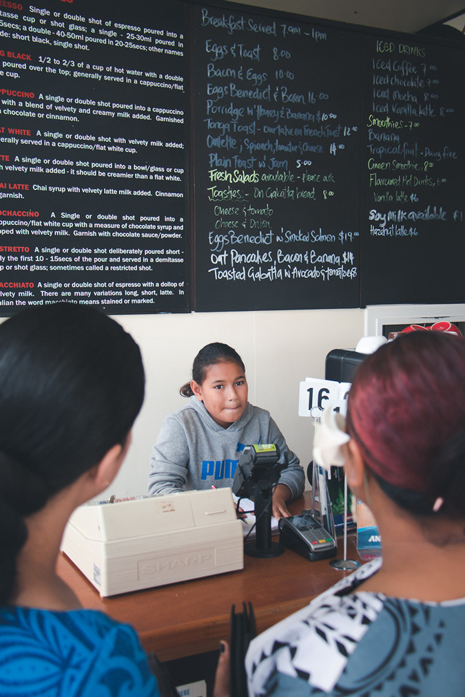 Rose's daughter Mya serving customers at Coffee Post