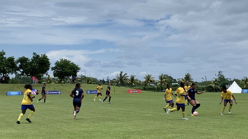 Team American Samoa [dark blue] playing against Solomon Islands [yellow]