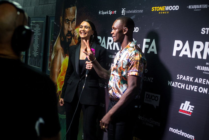 Leilani behind the scenes interviewing Israel Adesanya at the Parker vs Fa showdown at Spark Arena