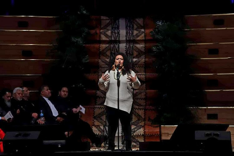 Marina Alefosio performing her poem 'Raiding the Dawn' at the official New Zealand government apology for the Dawn Raids