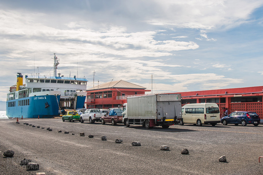 Cars lining up at Mulifanua wharf to drive on to the ferry - be sure to book in advance!
