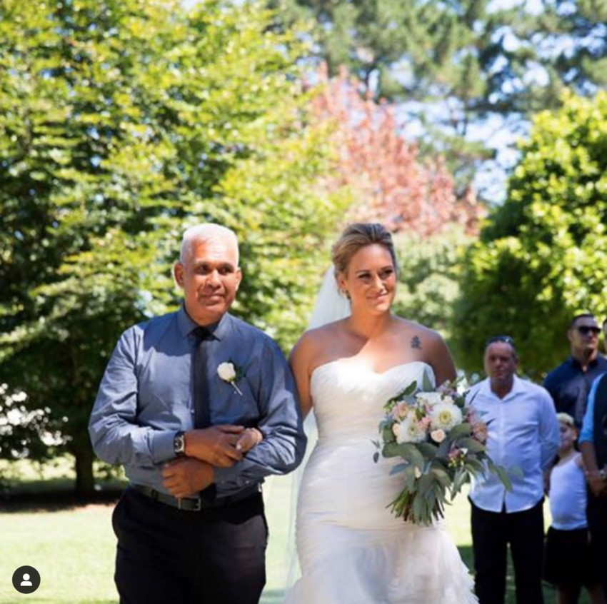 Otulea walking Cat down the aisle on her wedding day