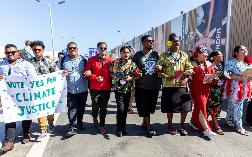 The "Vote Yes" on the Advisory Opinion message at COP27