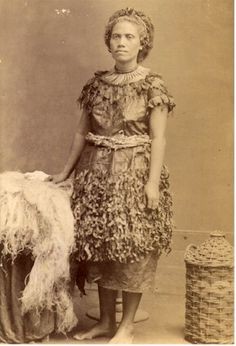 Wife of Seumanutafa standing next to an Ie Sina