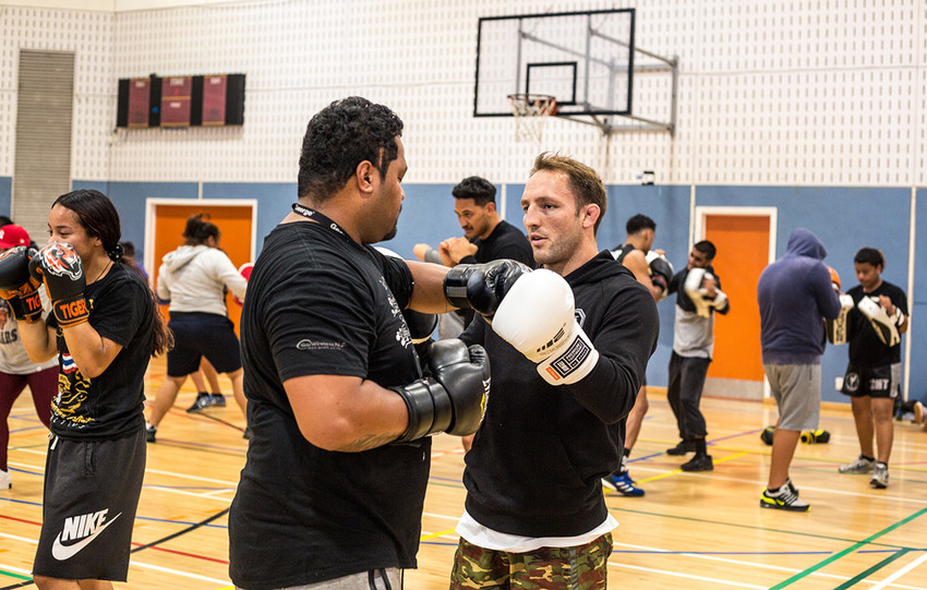 Brad Riddell helping with technique