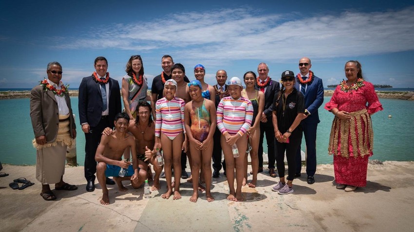 FINA delegation with a group of swimmers in Tonga