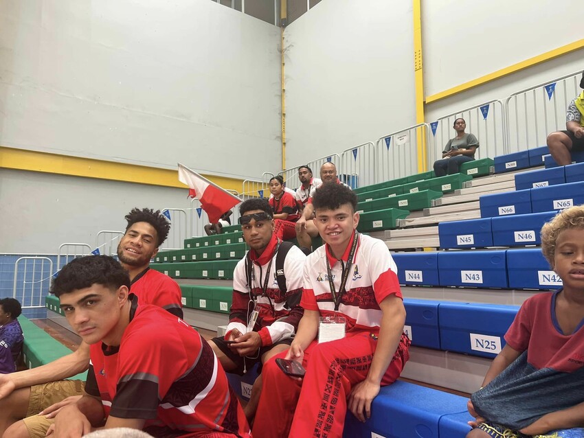 Lolo Jnr with members of the Tongan boxing team at the Pacific Games. Photo Credit: Lolo Snr