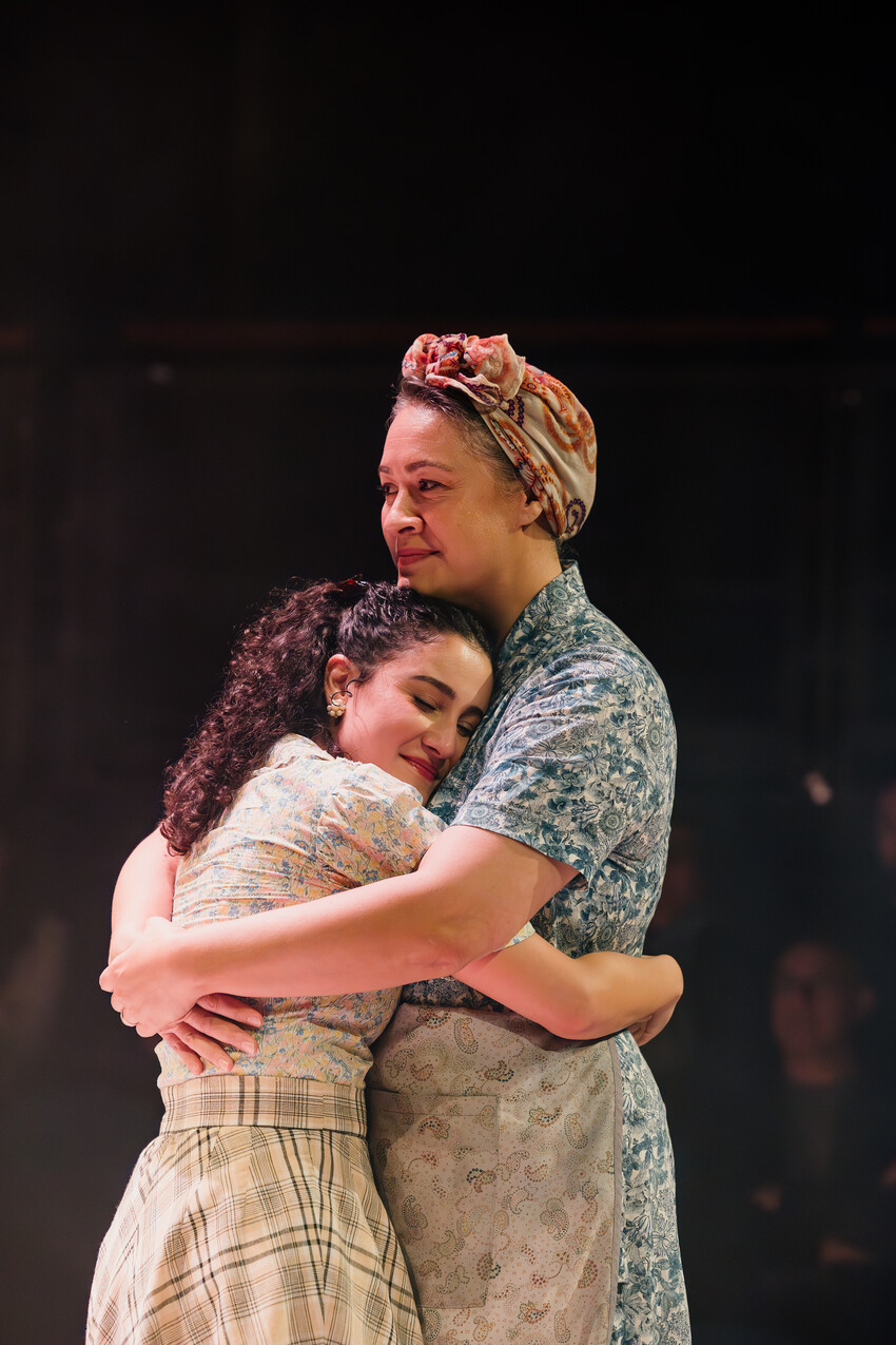 Stacey Leilua on stage embracing cast member - PC Andi Crown