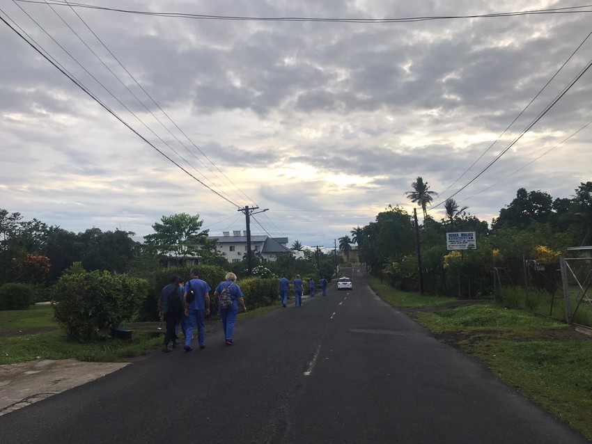 UK EMT team walking through one of the villages in Samoa as they help out with the measles epidemic