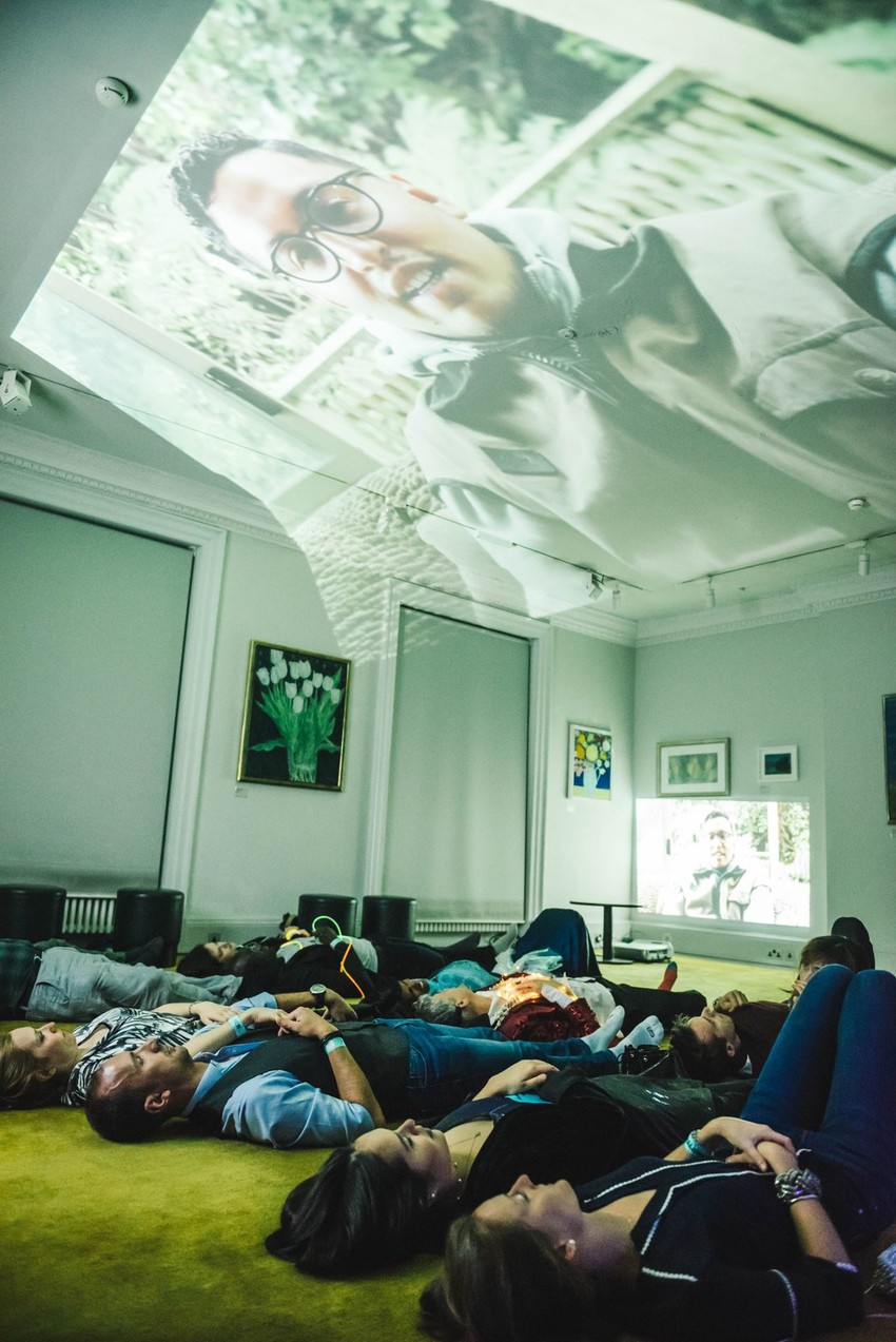 People enjoying Shakaiah's "Exotic Savage: The Decolonisation" at the Royal Academy of Arts in the Cosmic Ocean exhibition