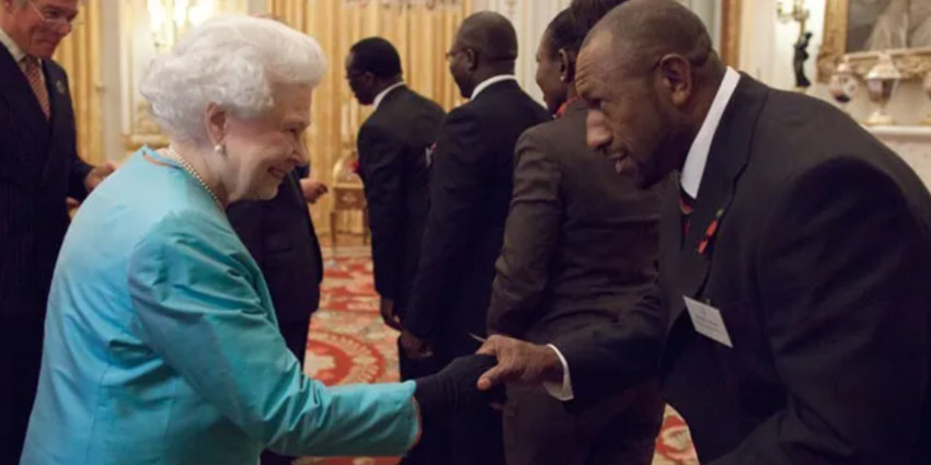 Picture from Totalrl.com. Menzie Yere meeting Her Majesty Queen Elizabeth II ahead of the 2013 World Cup
