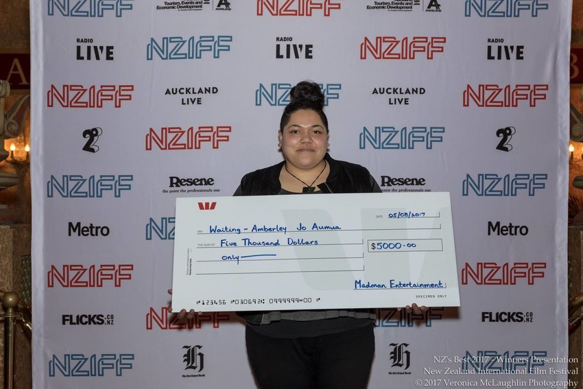 Amberley with her prize after winning the Best Short Film in New Zealand award at NZIFF 2017 for 'Waiting'
