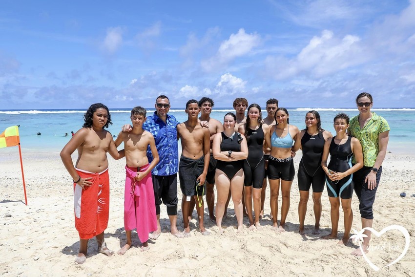 Ian and Cate with swimmers in Nikao Photo Credit: Island Love Photography