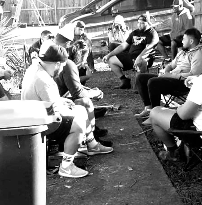 Papatoetoe Panthers rugby league club volunteer take a break while helping with cleaning at the Makiha family house.