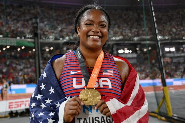 Laulauga with her history making Gold medal